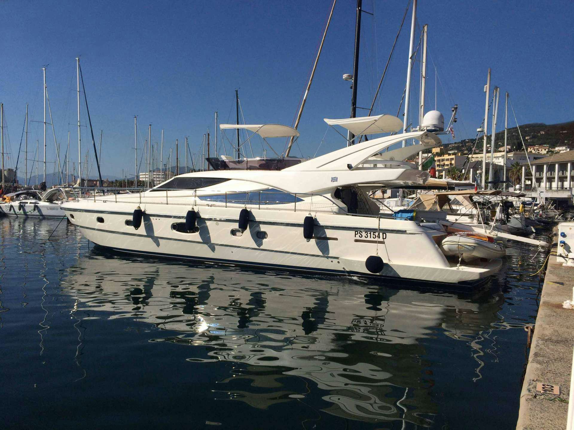 a boat docked at a pier aboard EL PUMA Yacht for Charter