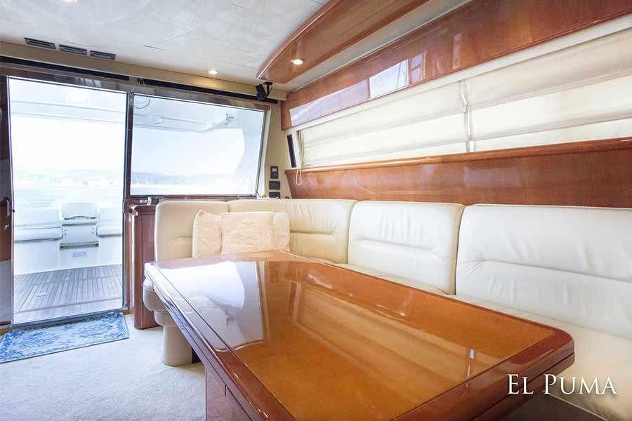 a room with a couch and a table aboard EL PUMA Yacht for Charter