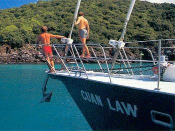 men on a trampoline aboard CUAN LAW Yacht for Charter
