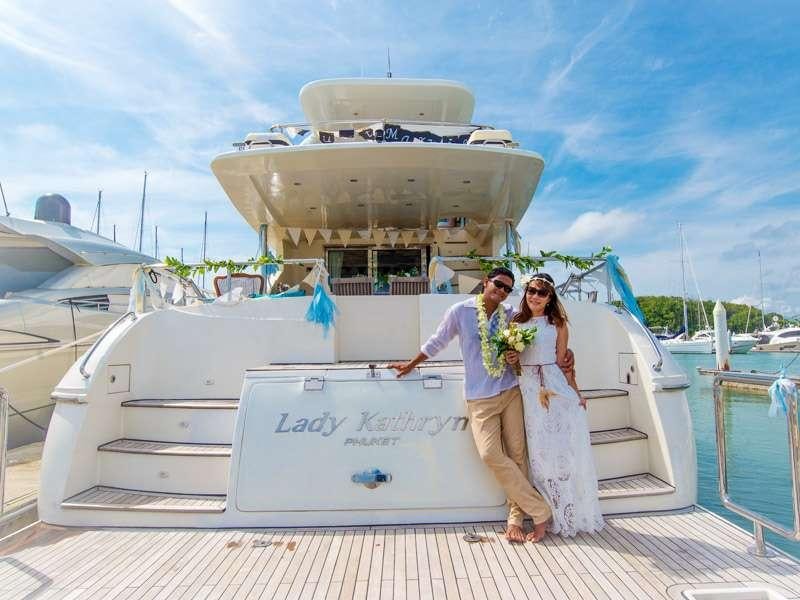 a man and woman posing for a picture on a boat aboard LADY KATHRYN Yacht for Charter