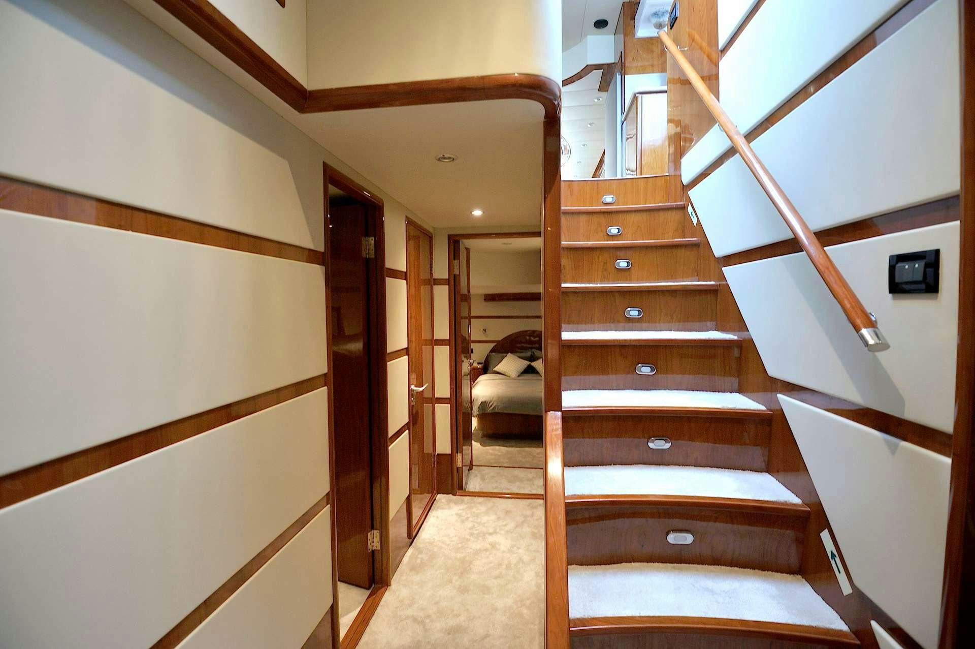 a wooden staircase in a house aboard LADY KATHRYN Yacht for Charter