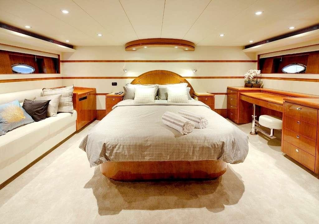a bedroom with two beds aboard LADY KATHRYN Yacht for Charter