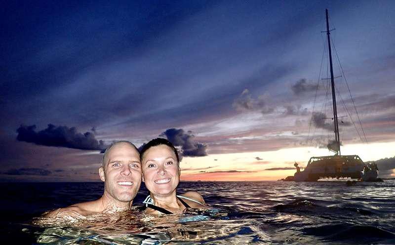 two people in a body of water aboard PELICAN Yacht for Charter