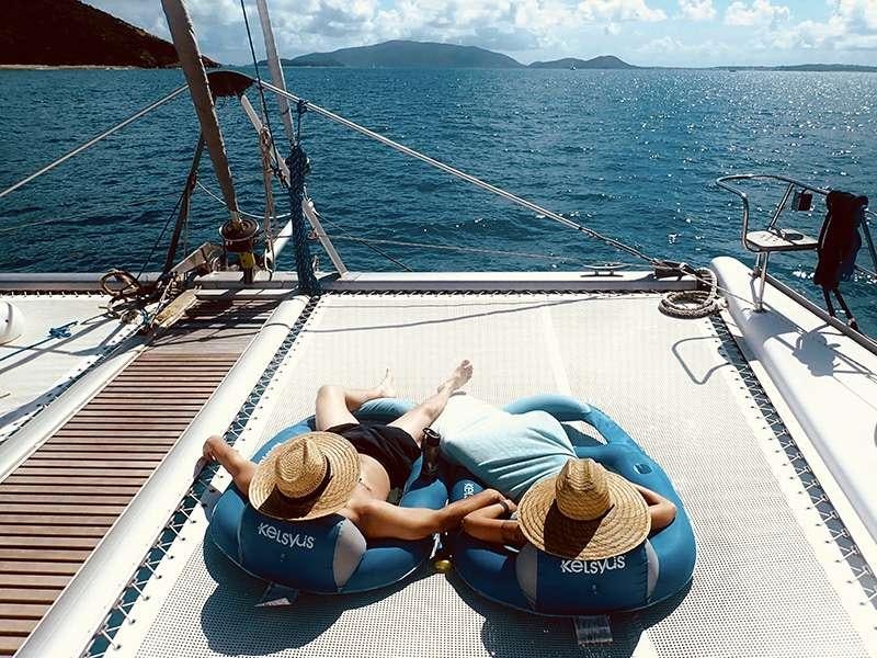a couple of people on a boat aboard PELICAN Yacht for Charter