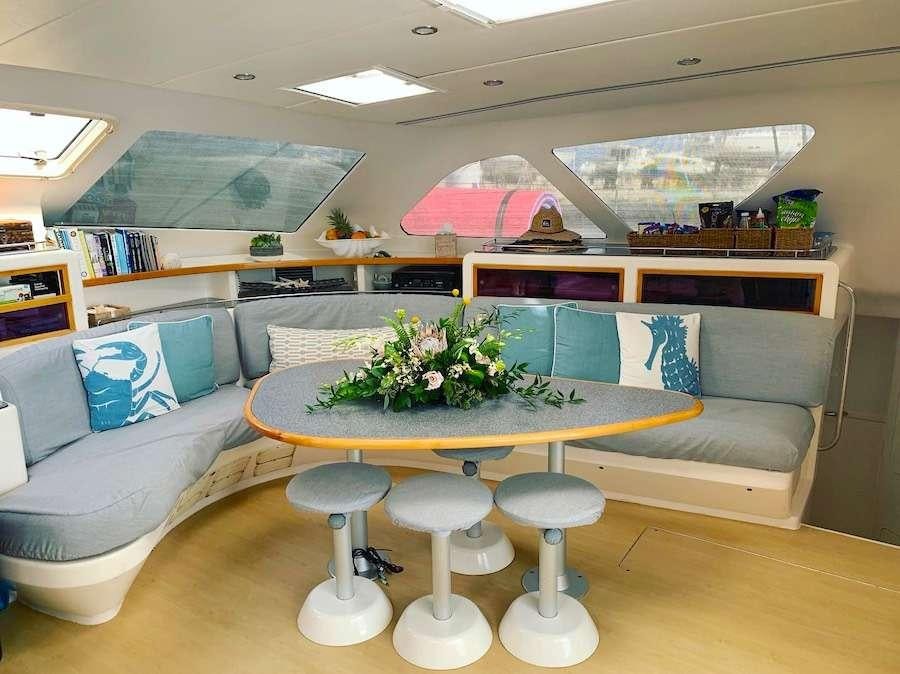 a room with a table and chairs aboard PELICAN Yacht for Charter