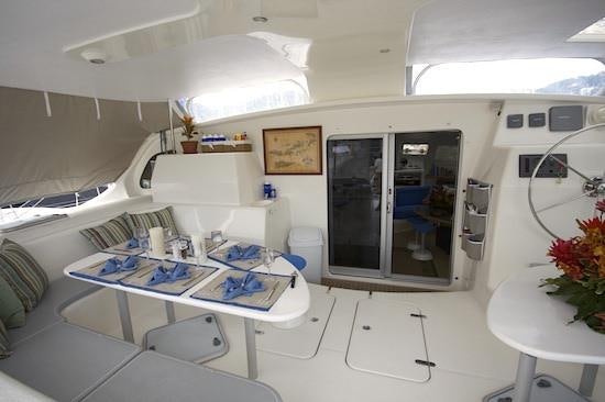 a room with a bed and desk aboard PELICAN Yacht for Charter
