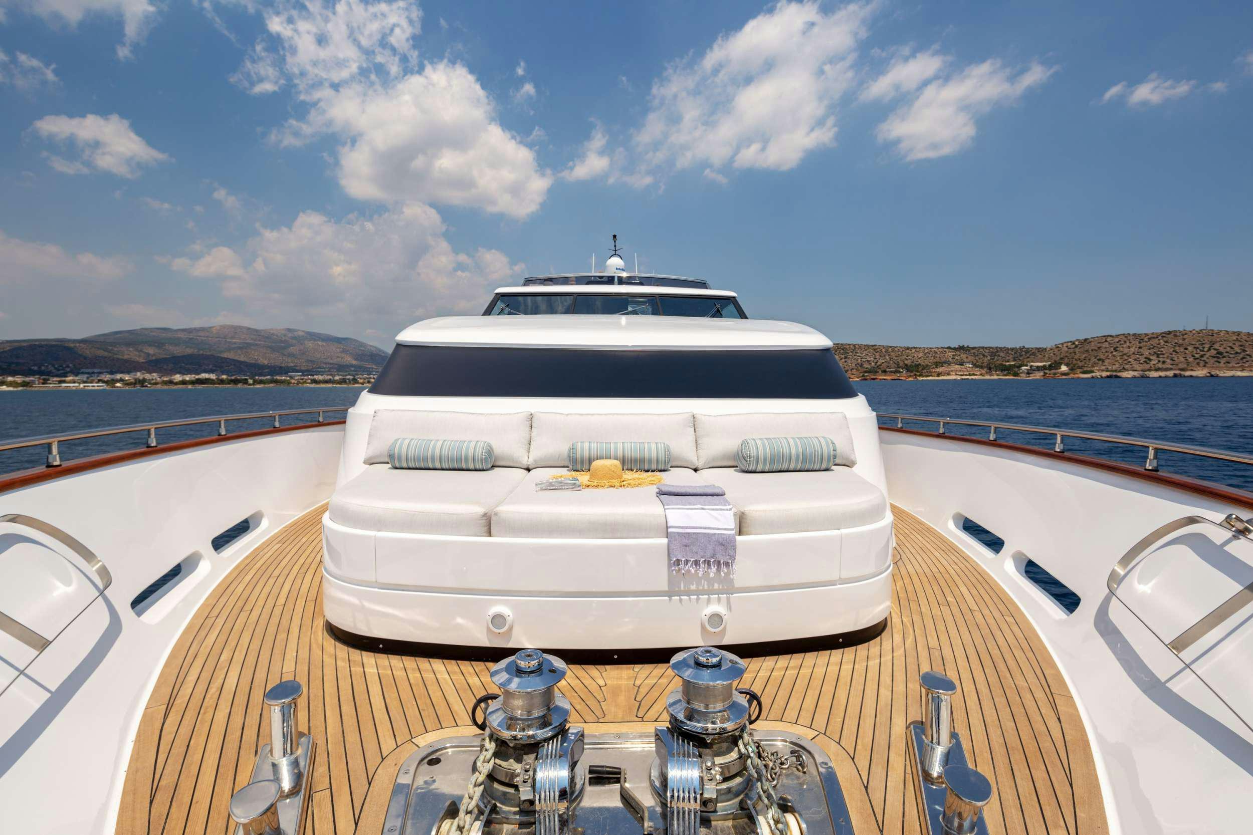 a boat on a water body aboard GRACE Yacht for Charter