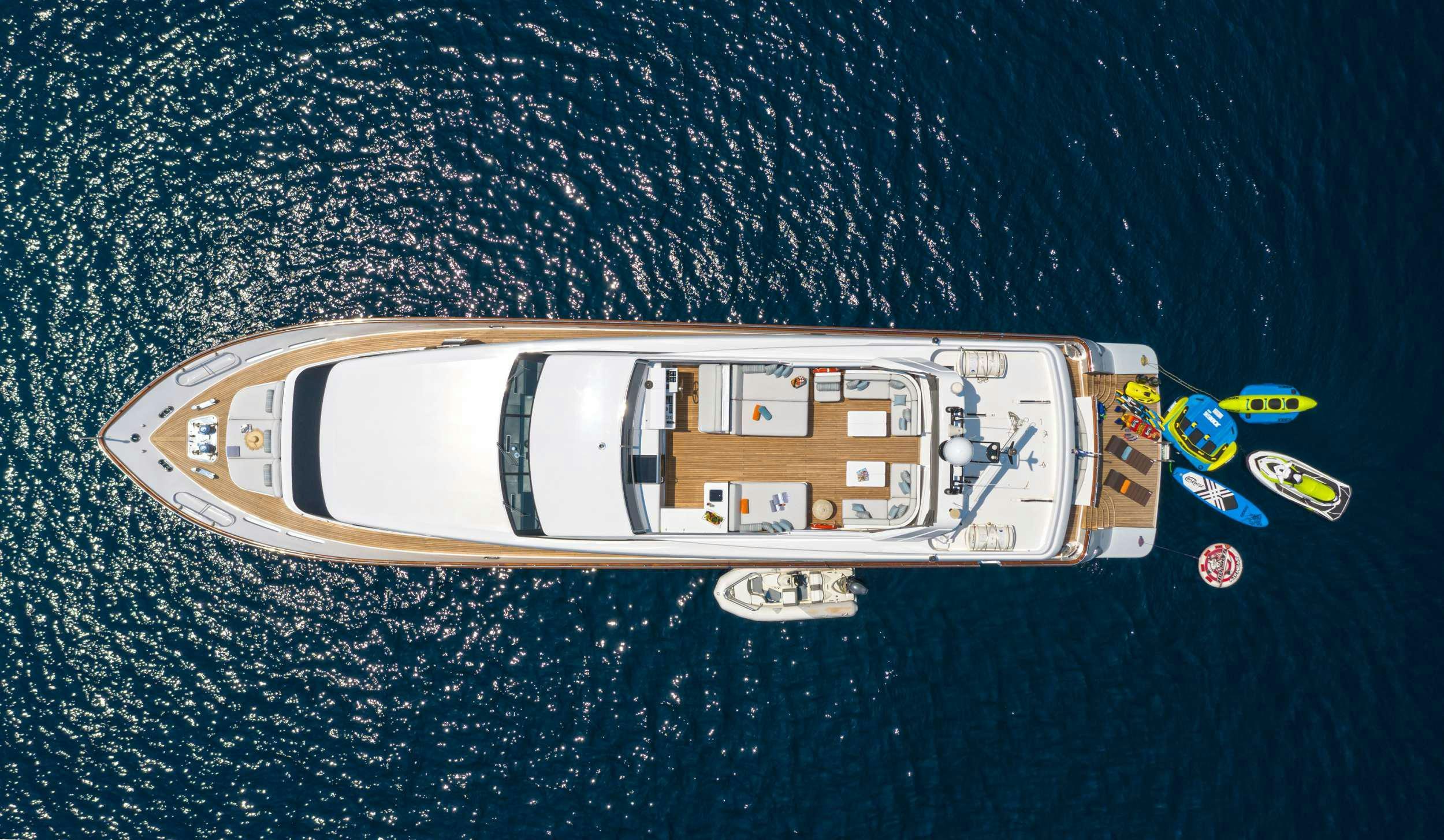a toy ship on a blue surface aboard GRACE Yacht for Charter