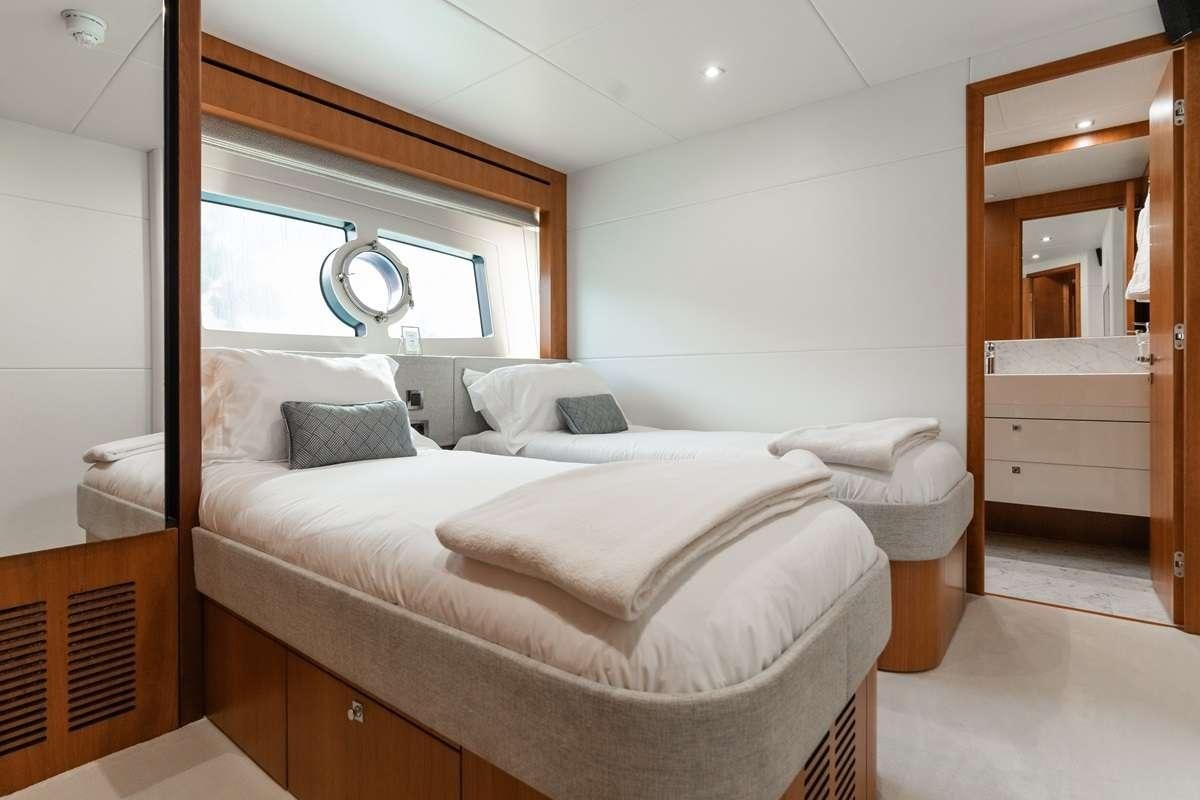 a bed in a room aboard PLAY THE GAME Yacht for Charter