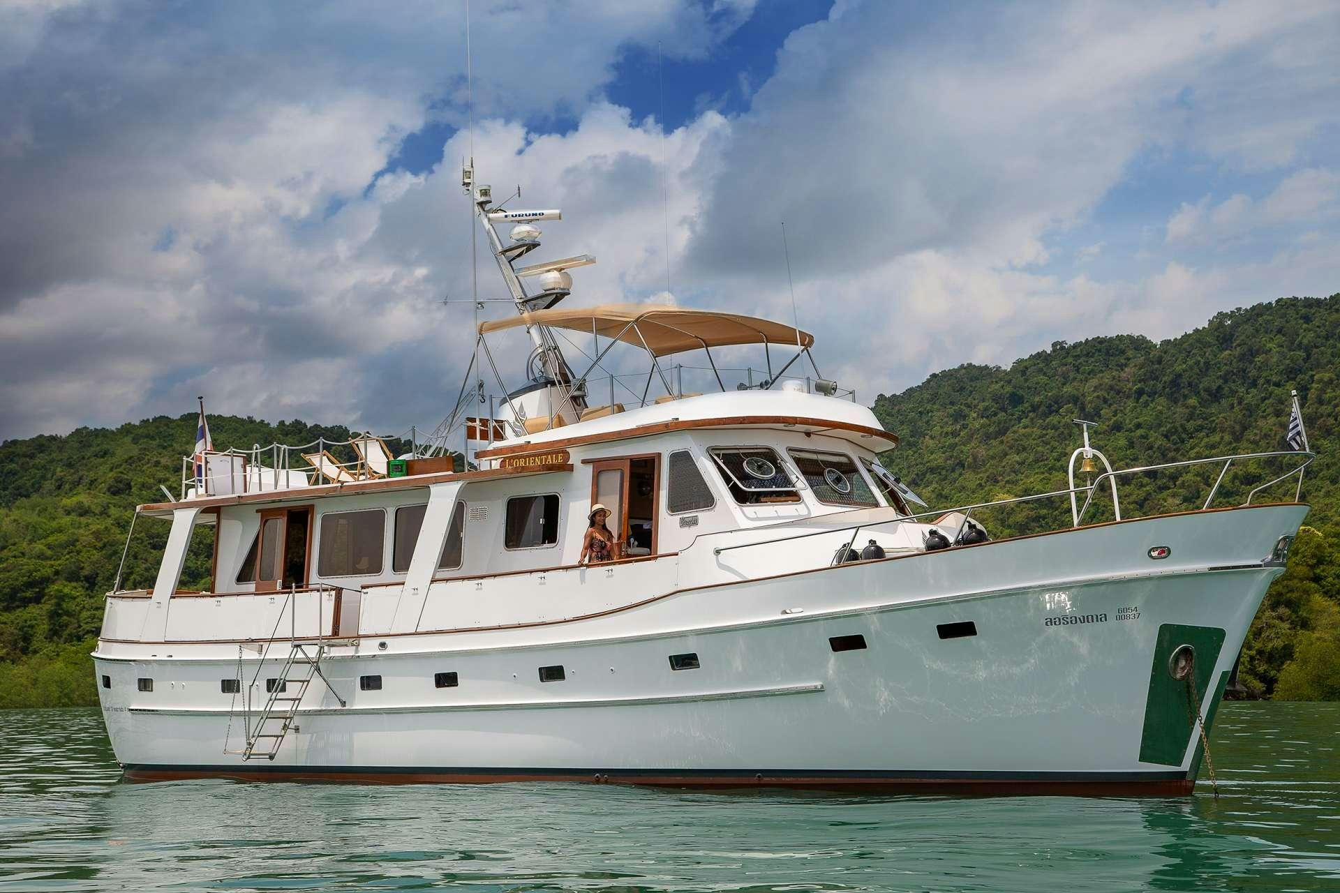 a white boat on the water aboard L'ORIENTALE Yacht for Charter
