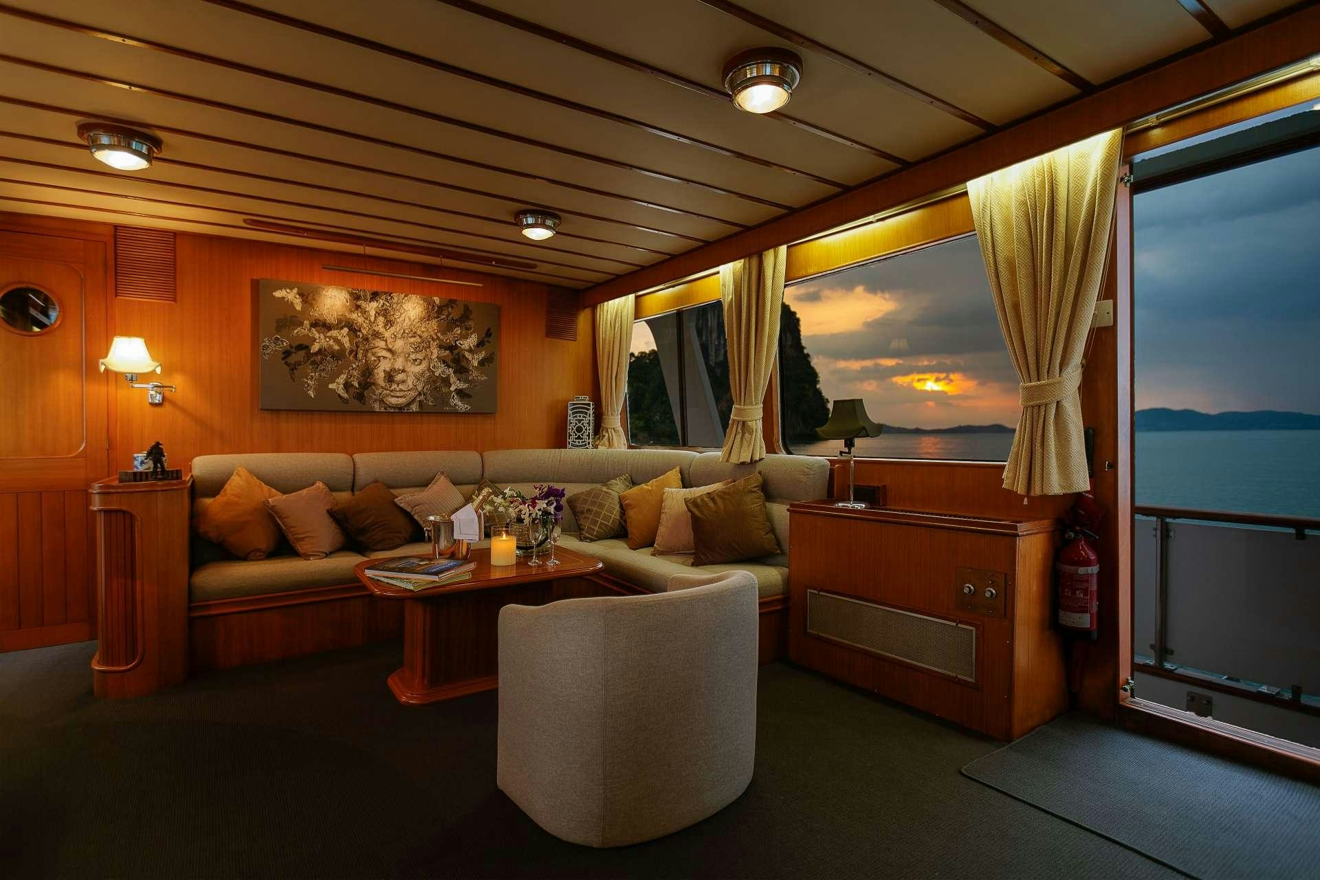 a living room with a large window aboard L'ORIENTALE Yacht for Charter