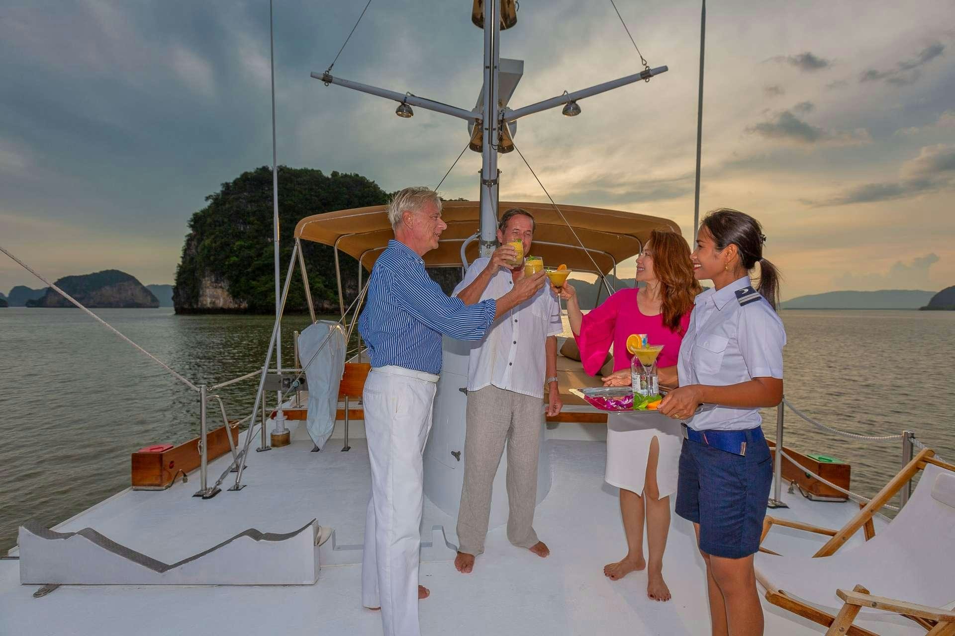 a group of people on a boat aboard L'ORIENTALE Yacht for Charter