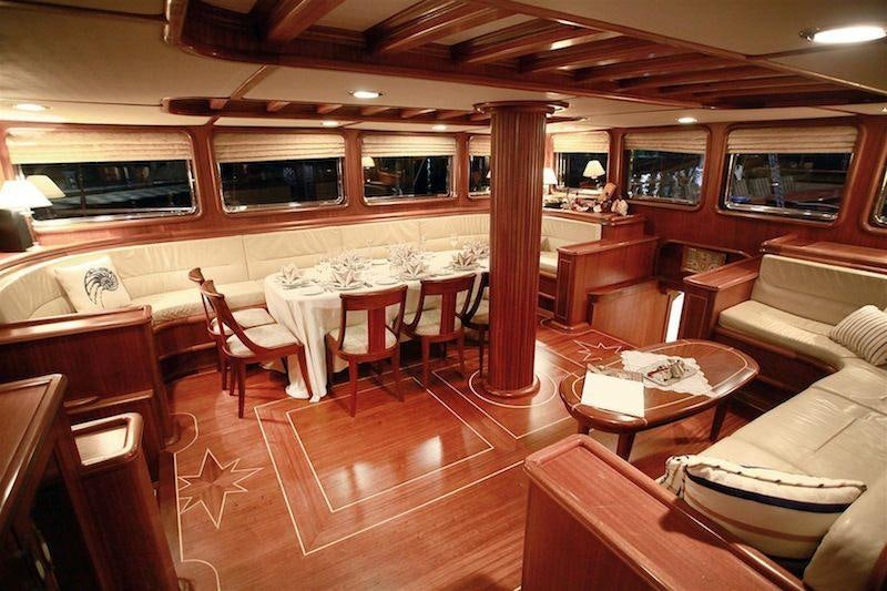 a restaurant with tables and chairs aboard NURTEN A Yacht for Charter