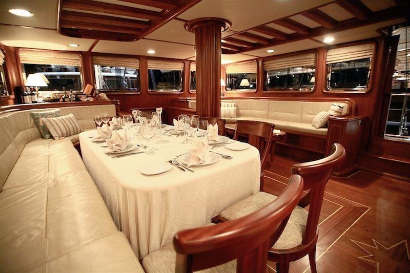 a restaurant with tables and chairs aboard NURTEN A Yacht for Charter