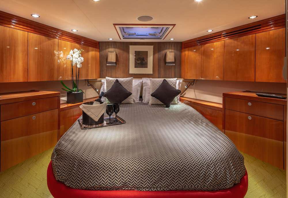 a large bed in a room aboard ASTRAPE Yacht for Charter