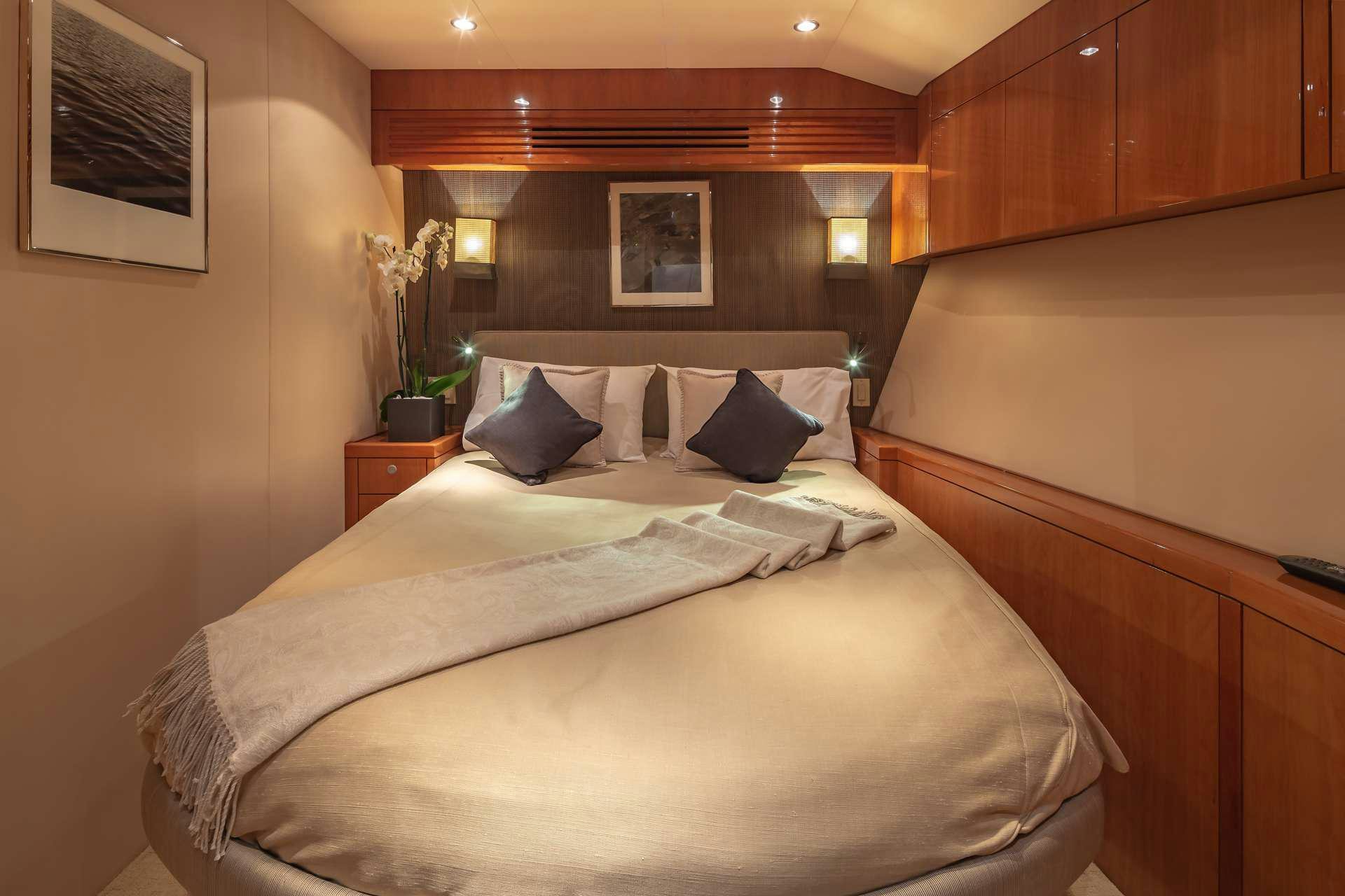 a bed with white sheets aboard ASTRAPE Yacht for Charter
