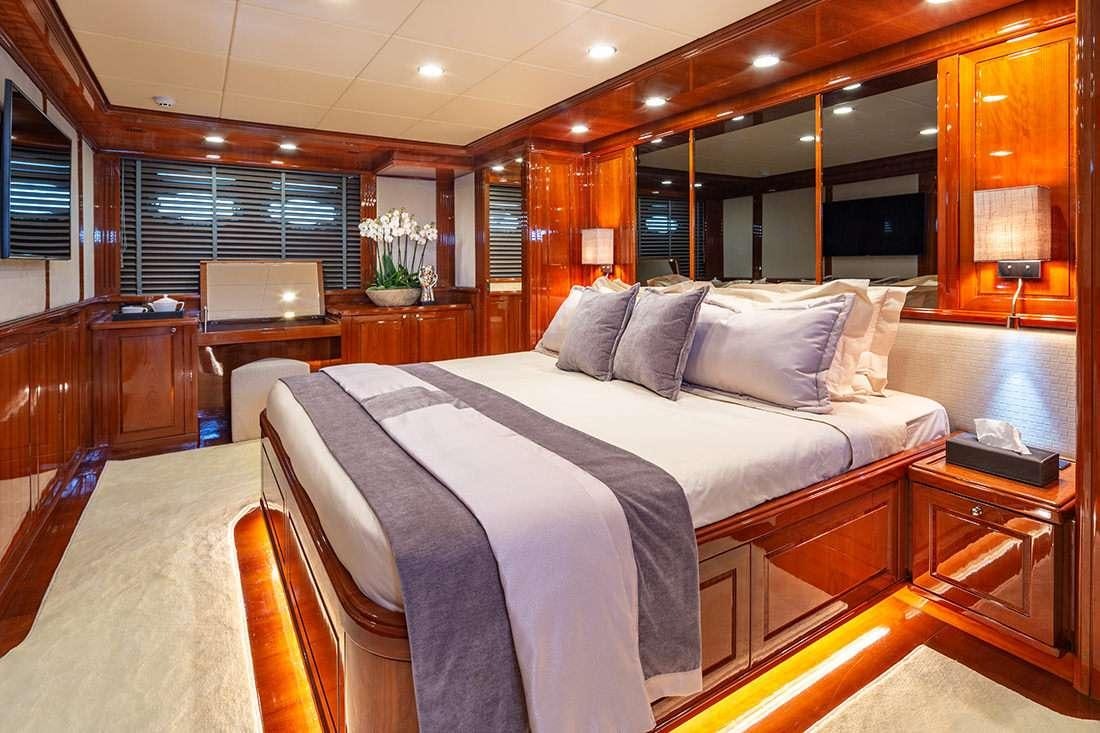 a large bed in a room aboard DIVINE Yacht for Charter