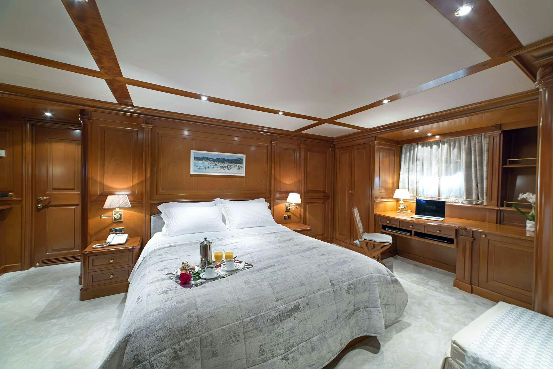 a bed in a room aboard AQUILA Yacht for Charter