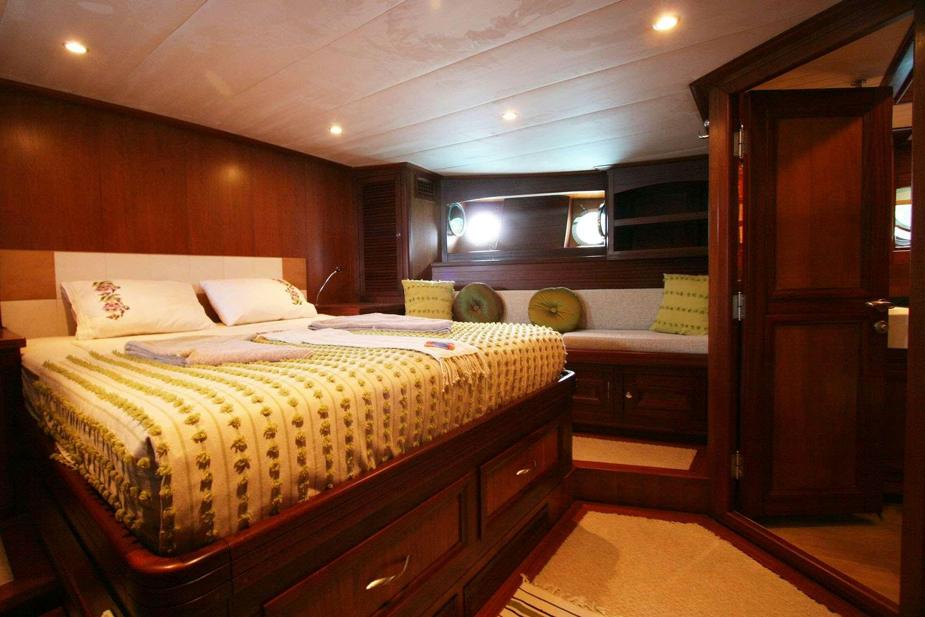 a bedroom with a bed and a closet aboard LADY FREYA Yacht for Charter