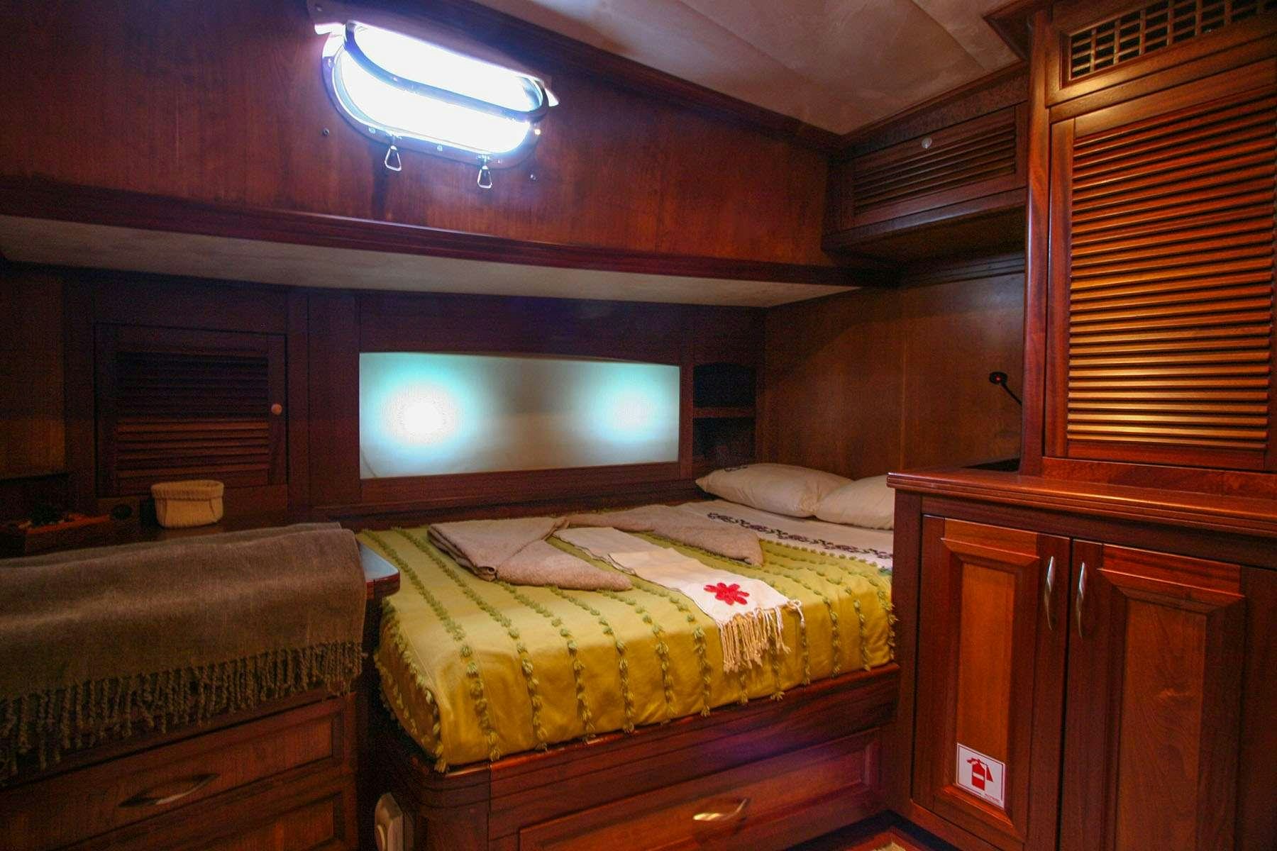 a room with two beds aboard LADY FREYA Yacht for Charter