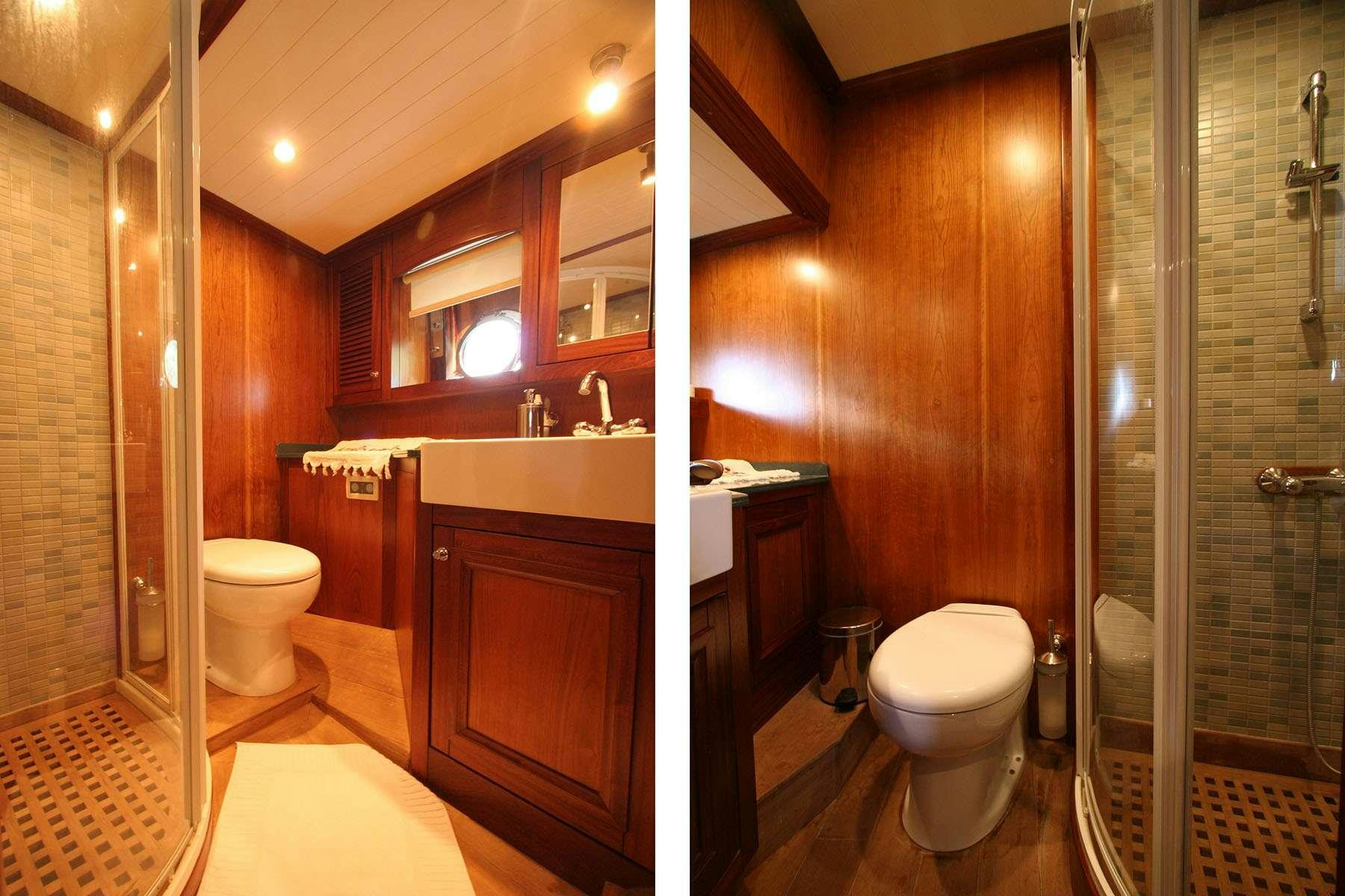 a bathroom with a glass shower aboard LADY FREYA Yacht for Charter