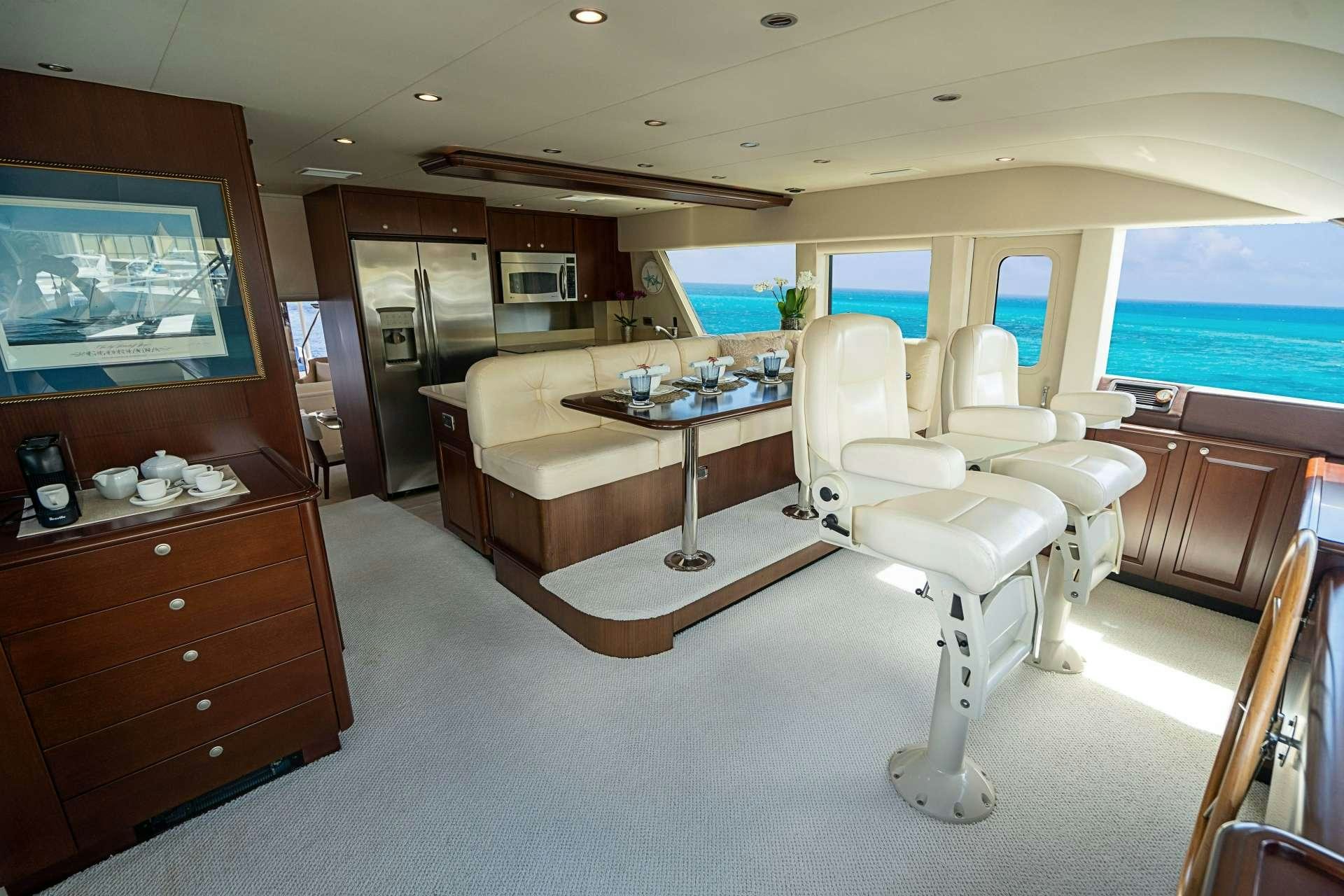 a room with a desk and chairs aboard TRUE NORTH Yacht for Charter