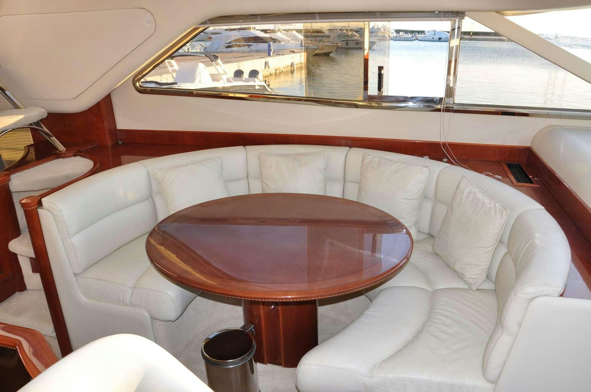 a table and chairs in a train aboard MARIA VEK Yacht for Charter
