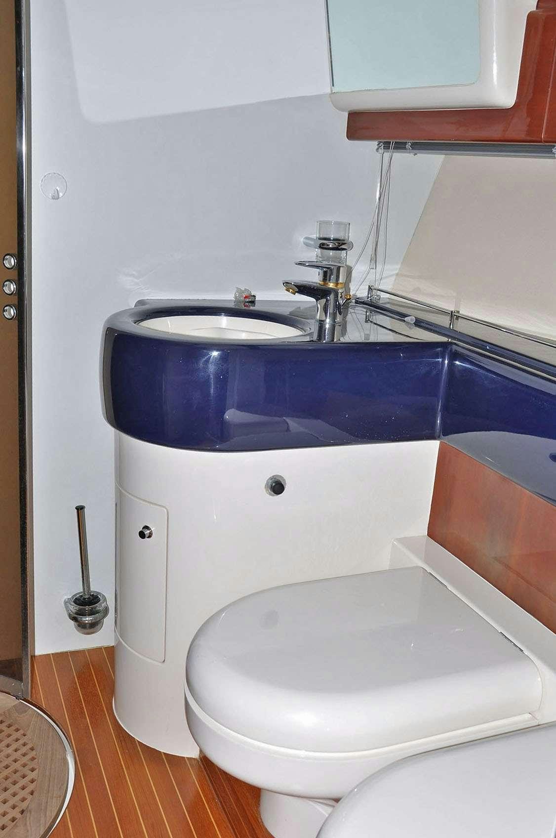 a sink and toilet in a bathroom aboard MARIA VEK Yacht for Charter