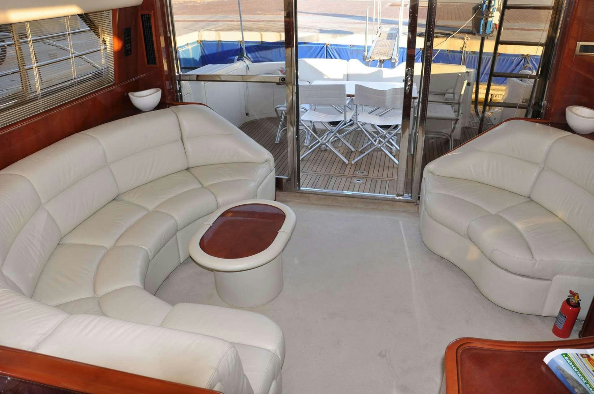 a living room with a glass door aboard MARIA VEK Yacht for Charter
