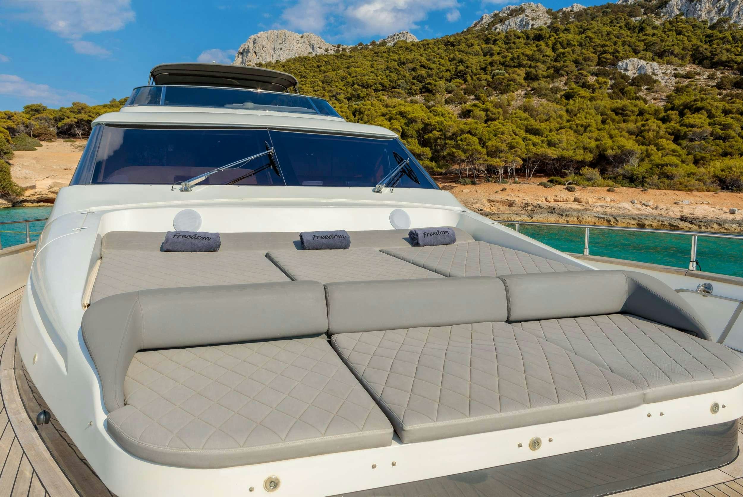 a white car on a boat aboard FREEDOM Yacht for Charter