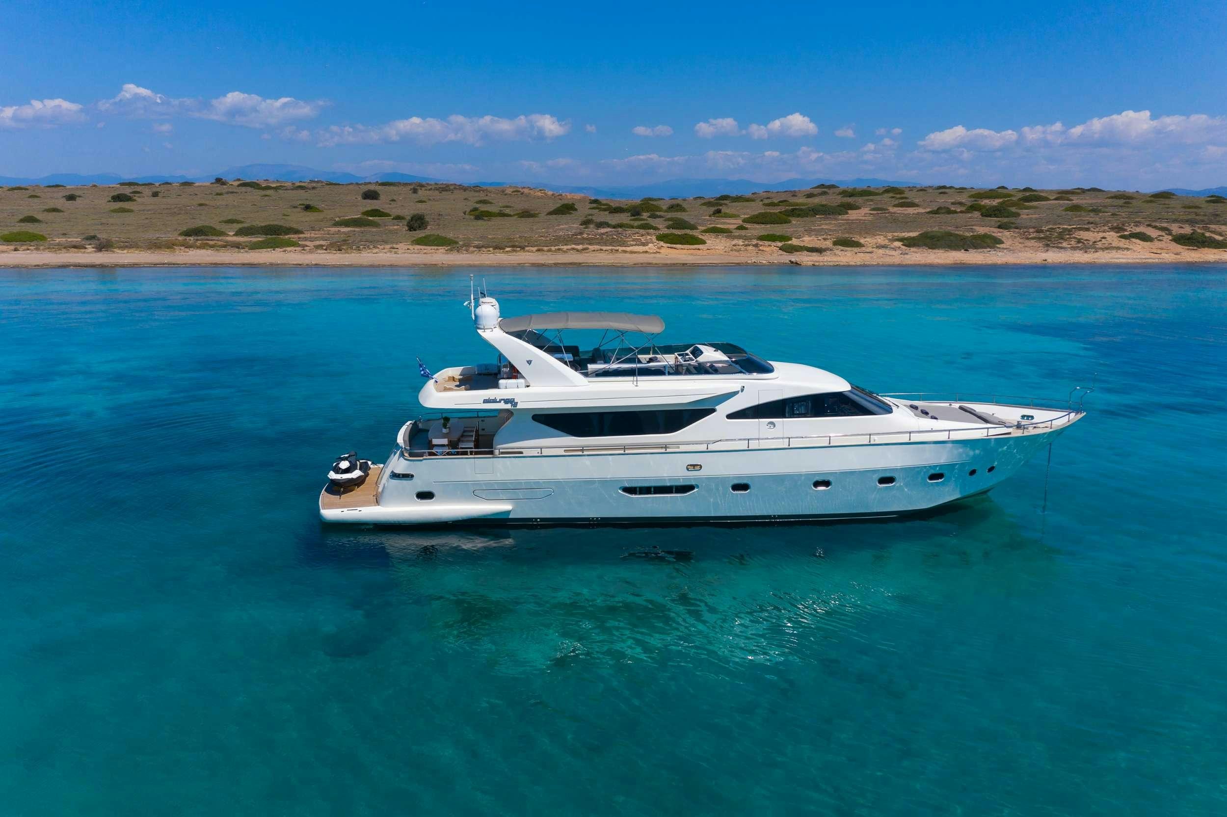 a white yacht in the water aboard FREEDOM Yacht for Charter