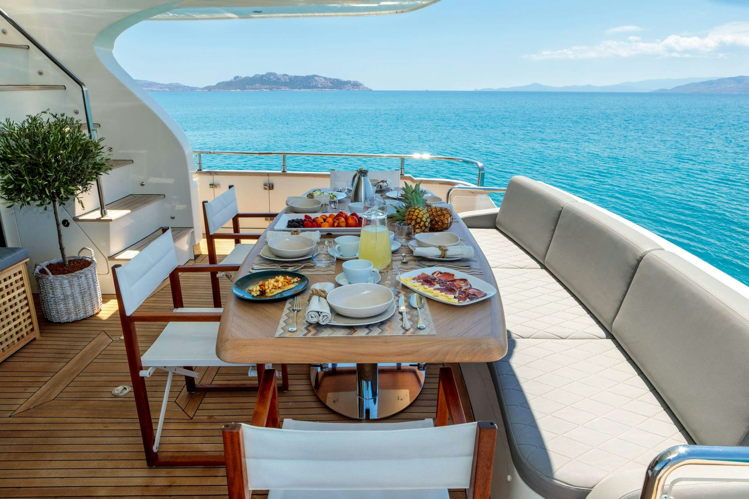 a table with food on it aboard FREEDOM Yacht for Charter