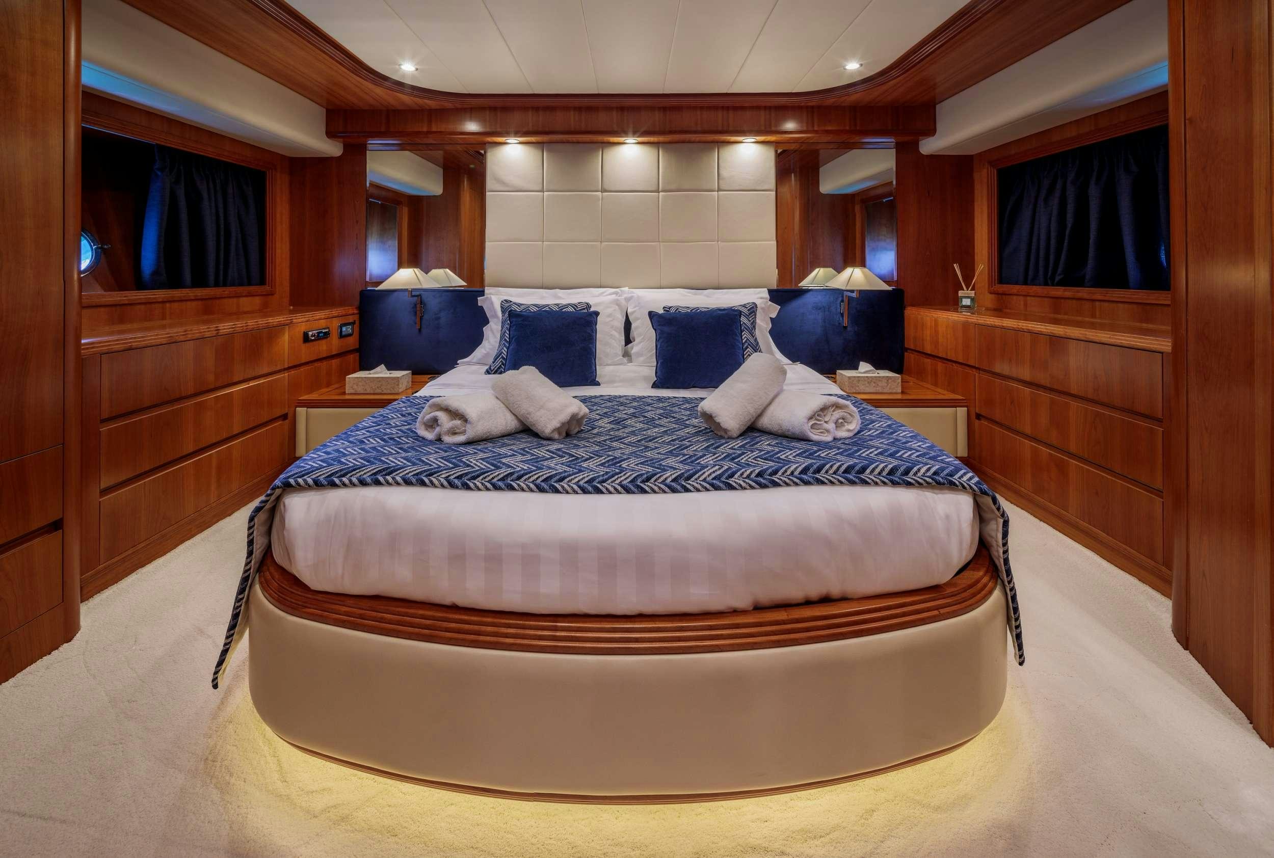 a bed in a room aboard FREEDOM Yacht for Charter