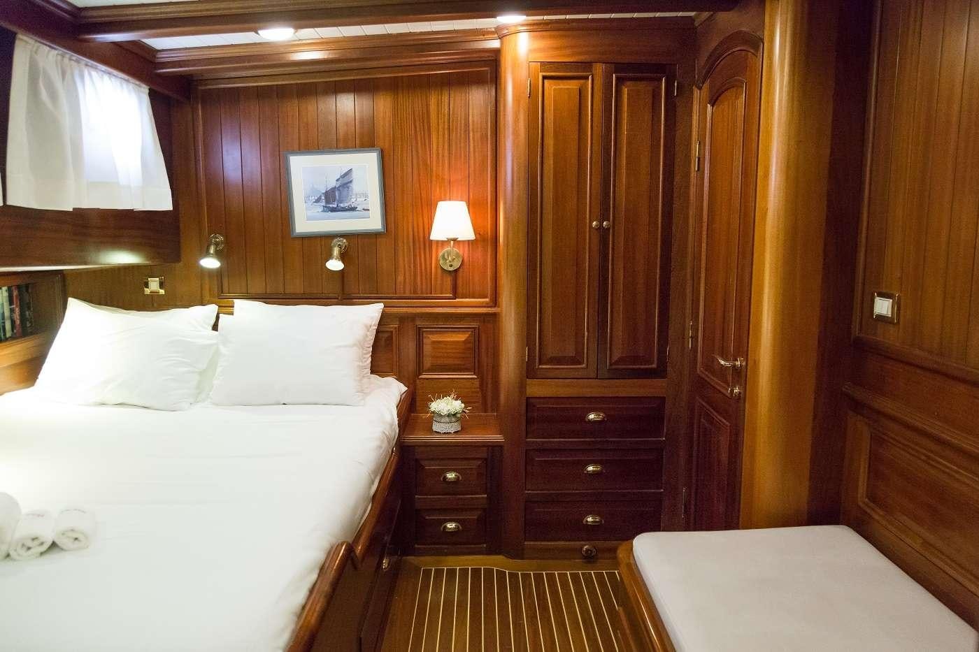 a bed in a room aboard ECCE NAVIGO Yacht for Charter
