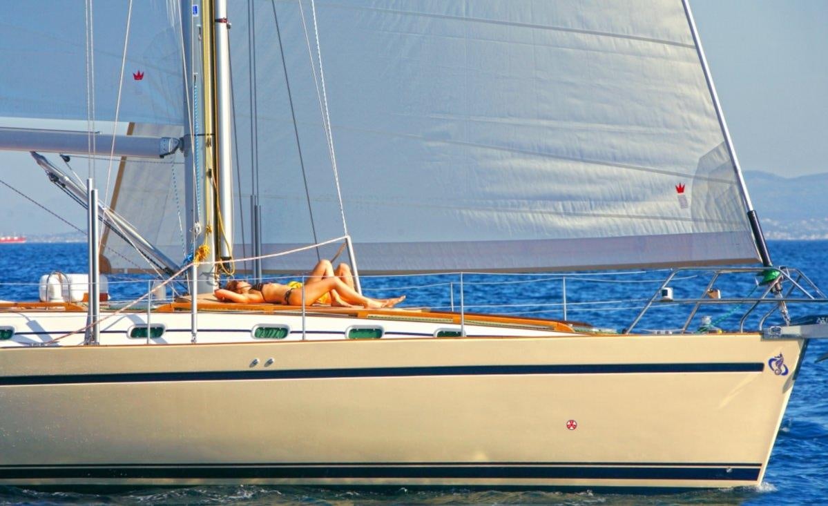 a person lying on a sailboat aboard MYTHOS Yacht for Charter