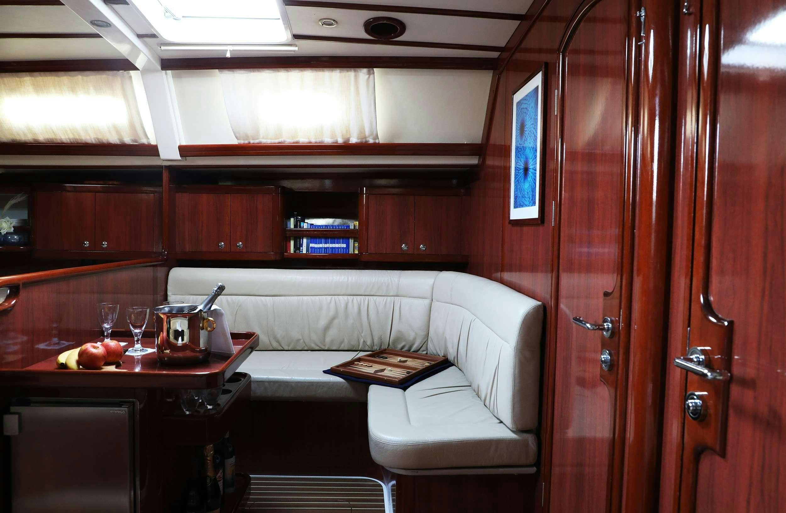 a room with a couch and a table aboard MYTHOS Yacht for Charter