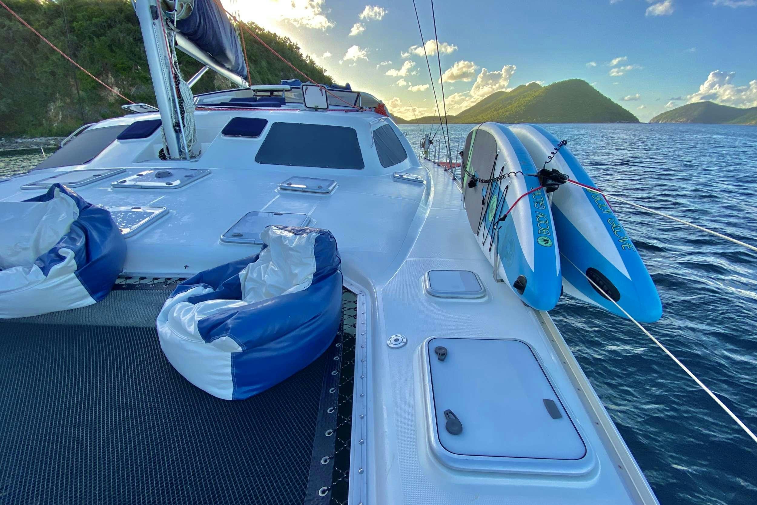 a boat with a blue cover on the front aboard YES DEAR Yacht for Charter