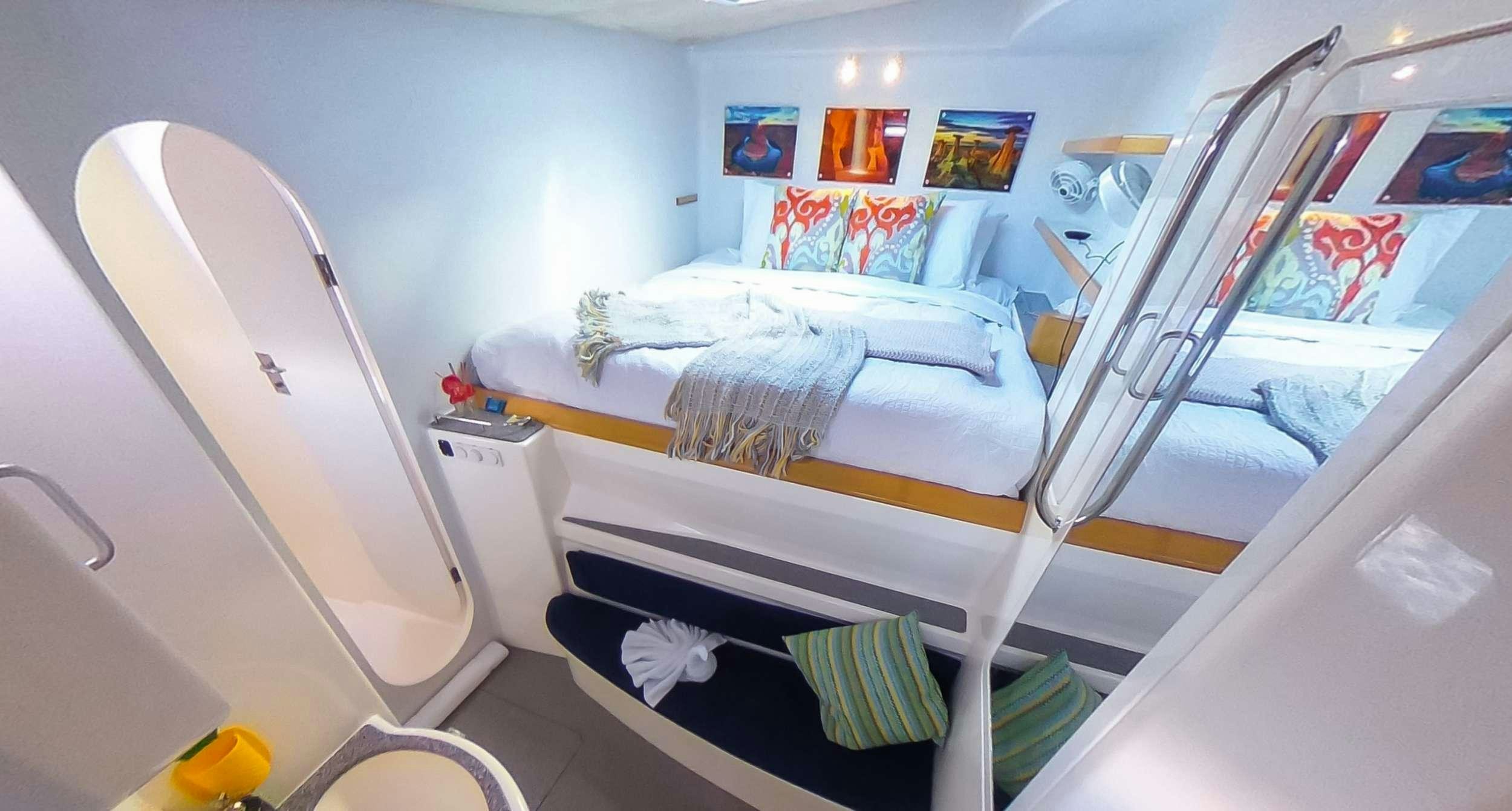 a bedroom with a bunk bed aboard YES DEAR Yacht for Charter