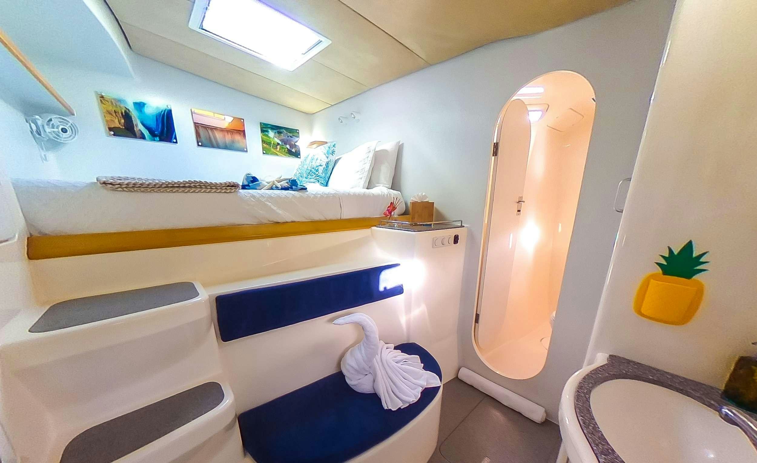 a bathroom with a tub and a toilet aboard YES DEAR Yacht for Charter