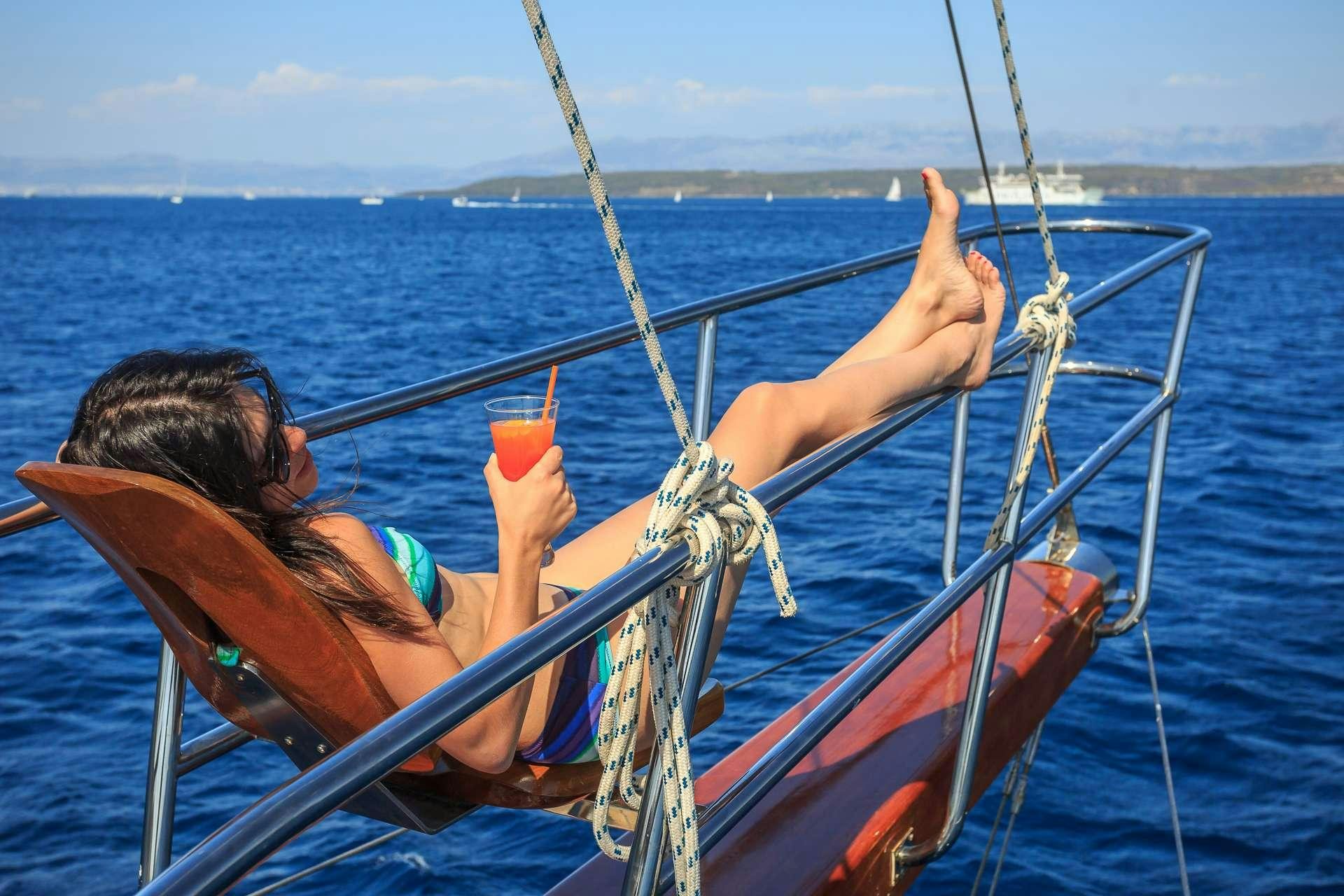 a person on a boat aboard ALLUREE Yacht for Charter