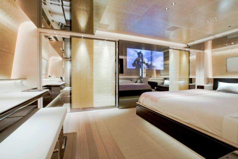 a room with a couple of beds aboard ASLEC 4 Yacht for Charter