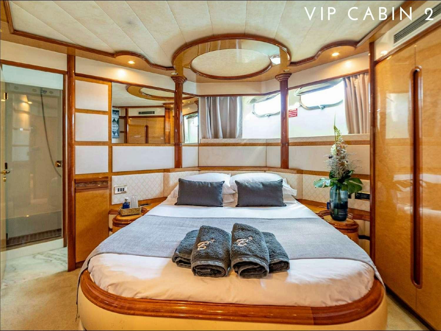 a bed in a room aboard B3 Yacht for Charter