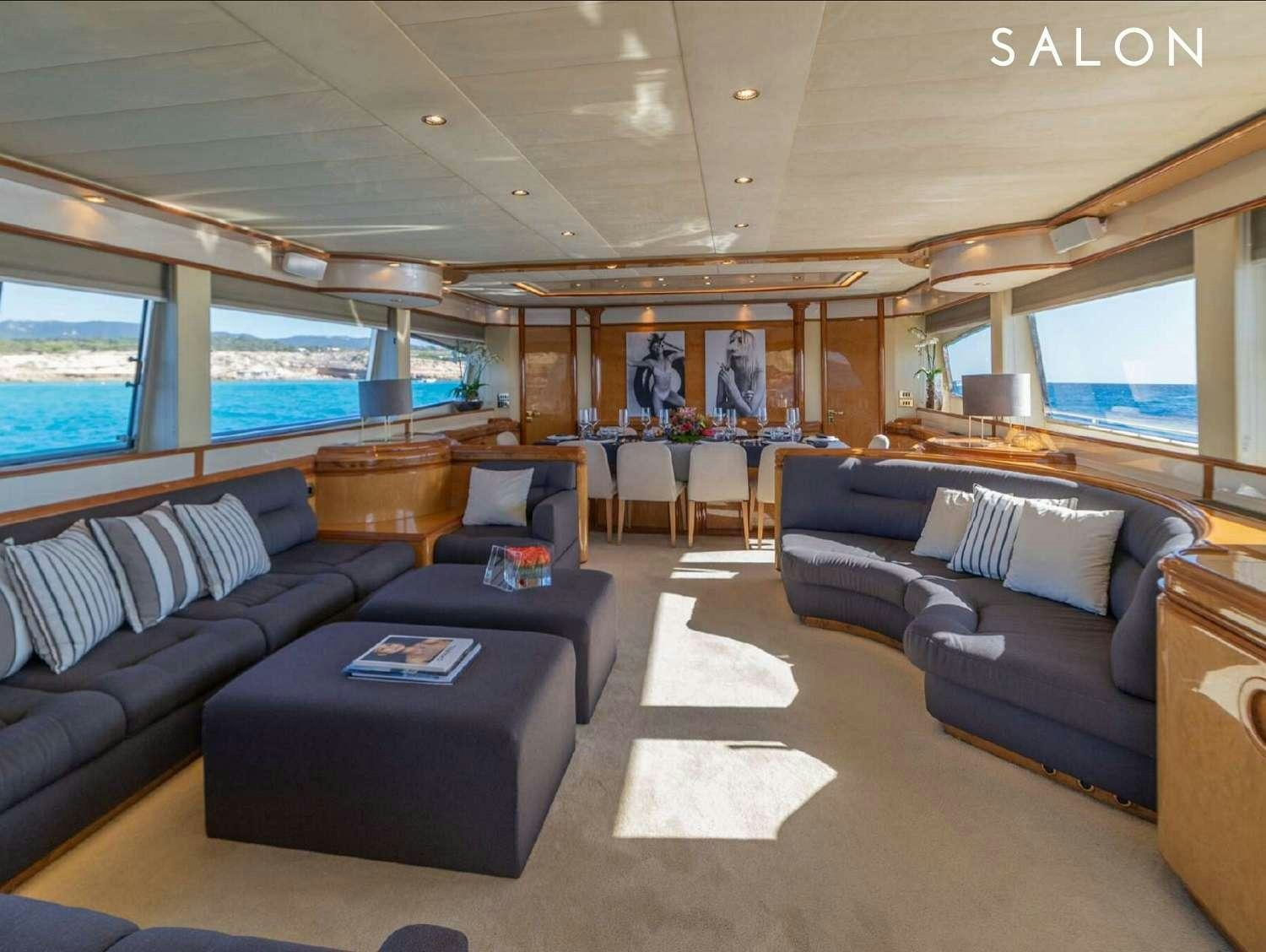 a living room with leather couches aboard B3 Yacht for Charter