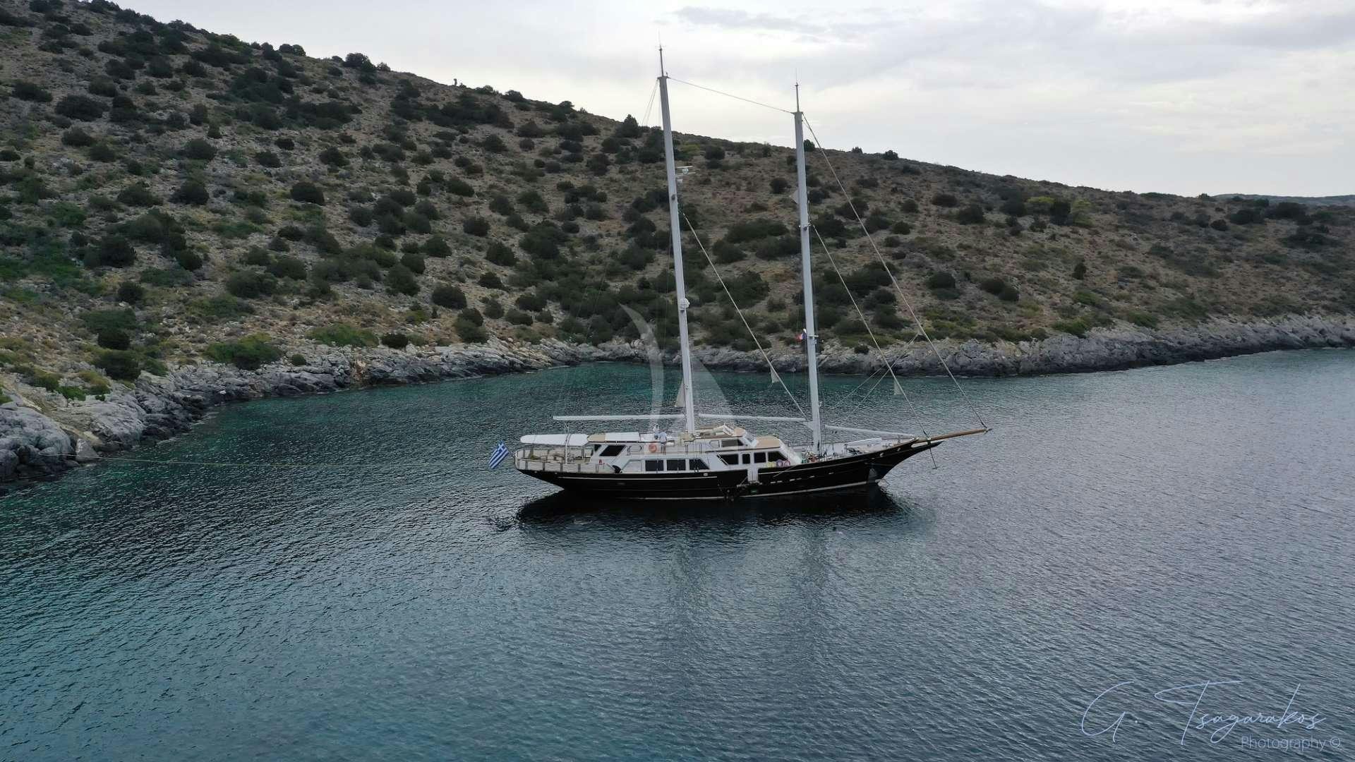 a boat sailing on the water aboard ALTHEA Yacht for Charter