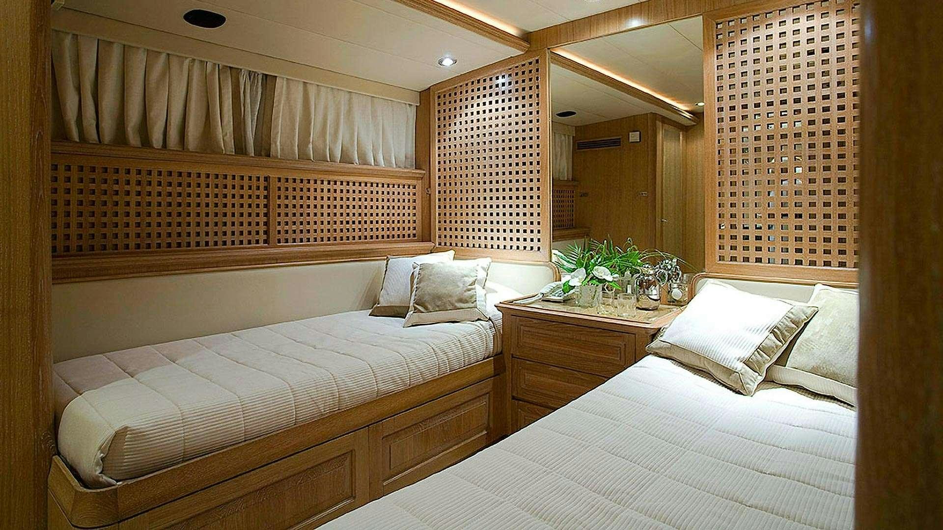 a room with two beds aboard ALTHEA Yacht for Charter