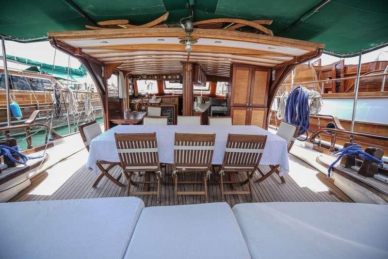 a boat with tables and chairs aboard GOLDEN PRINCESS Yacht for Charter