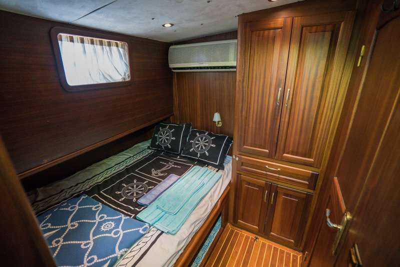 a bed in a room aboard GOLDEN PRINCESS Yacht for Charter