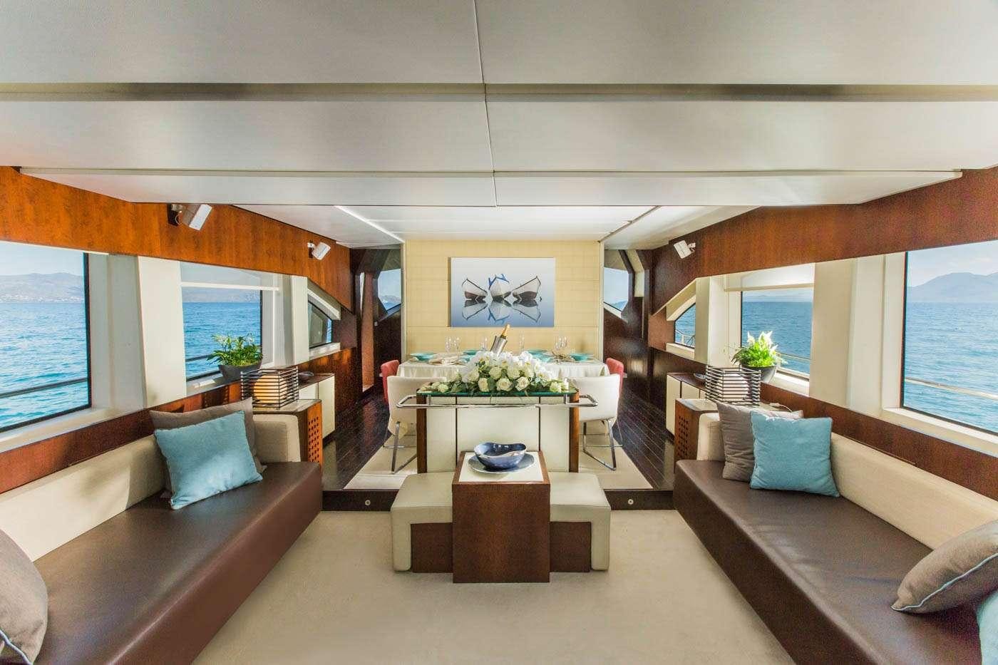 a living room with a couch and a coffee table aboard ULISSE Yacht for Charter