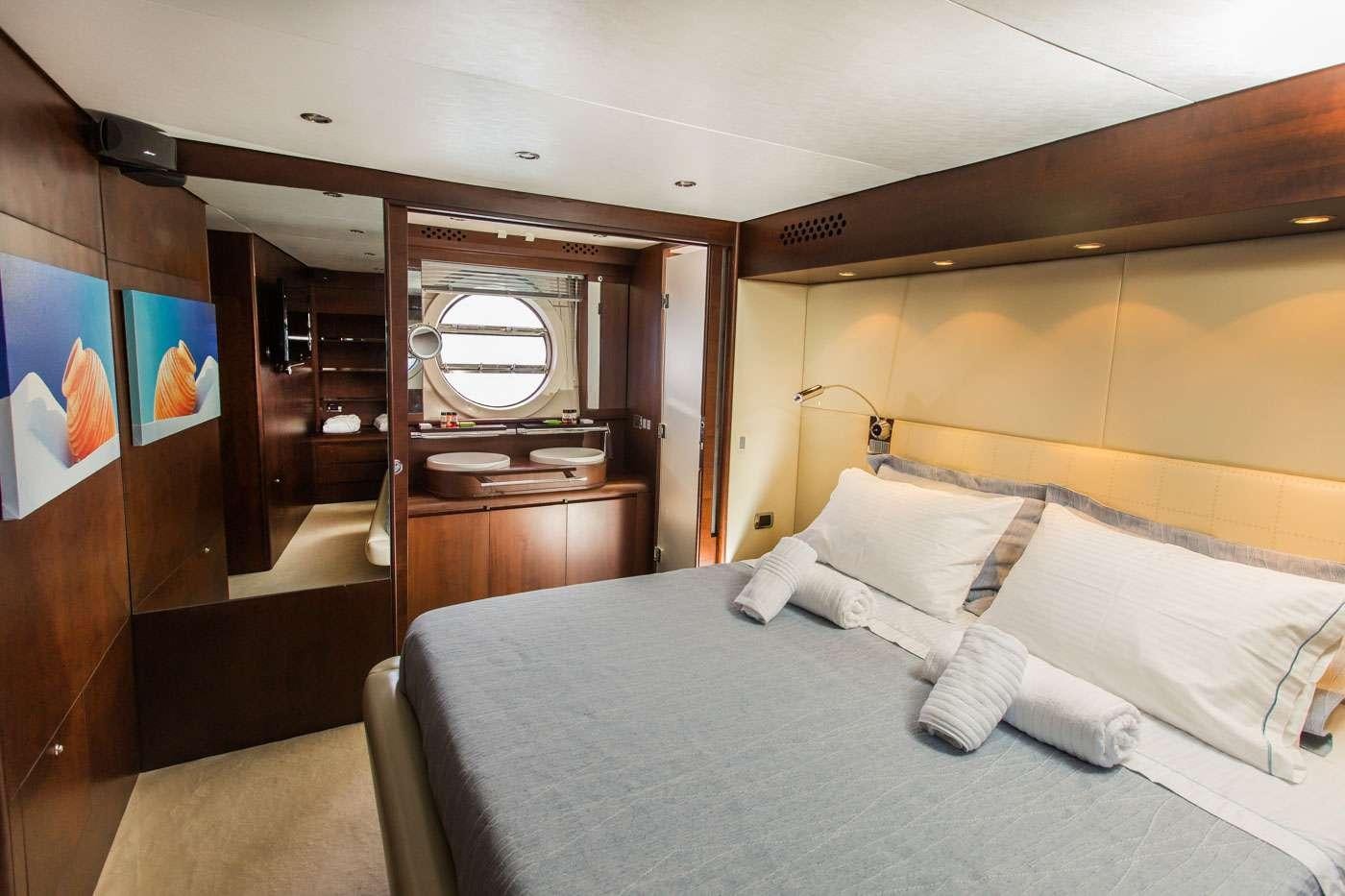 a bed in a room aboard ULISSE Yacht for Charter