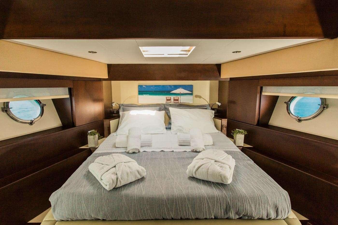 a bed with a large bed aboard ULISSE Yacht for Charter